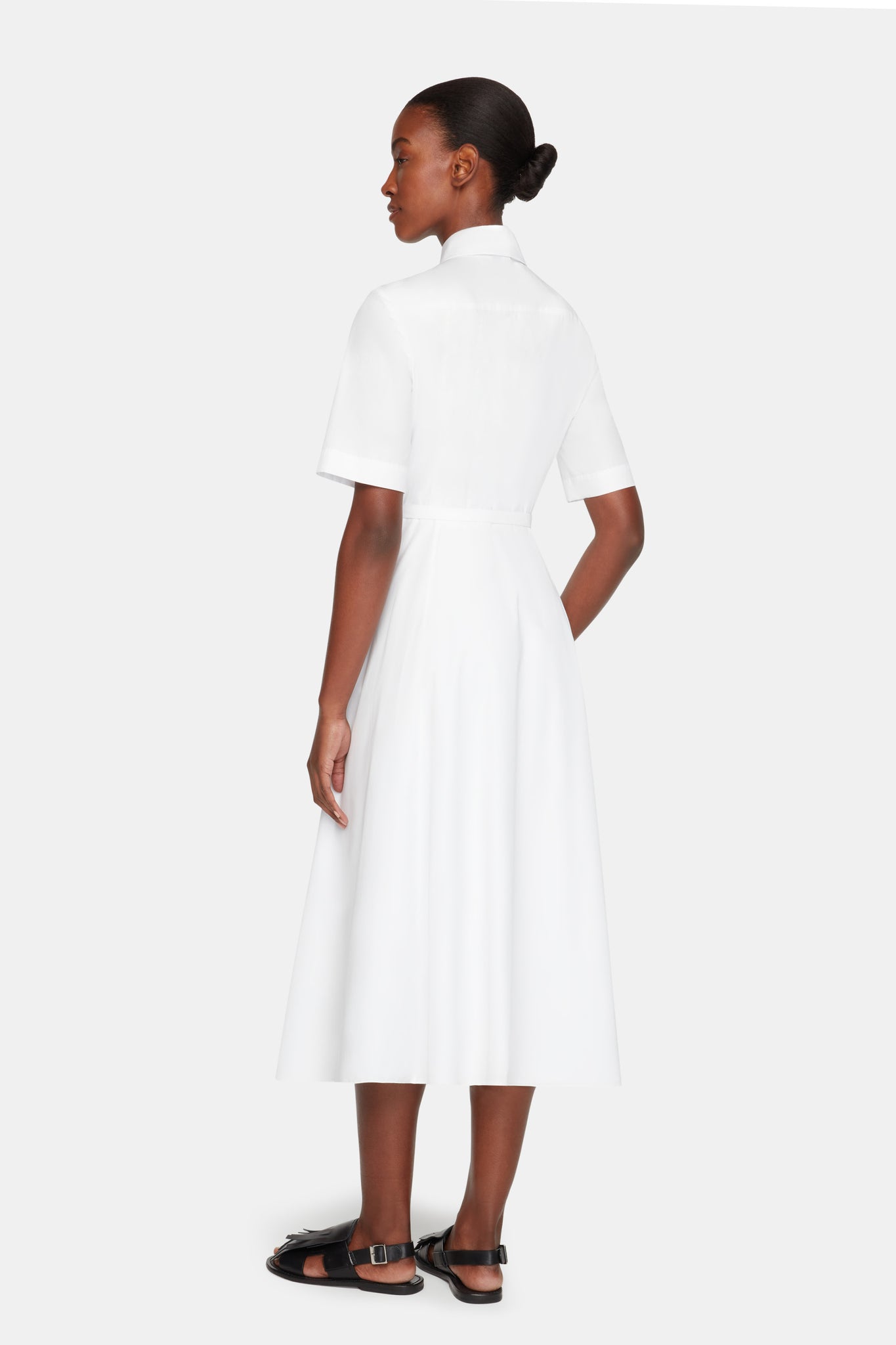 Rubie Short Sleeve Dress In White Cotton model back shot | Emilia 