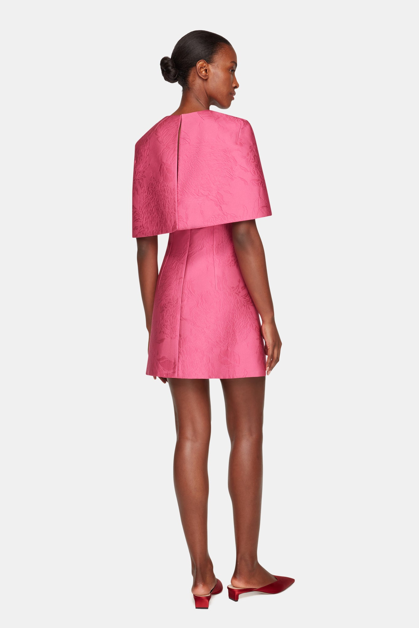 Virginie Cape In Hot Pink Embossed Cloque full length back shot | Emilia Wickstead