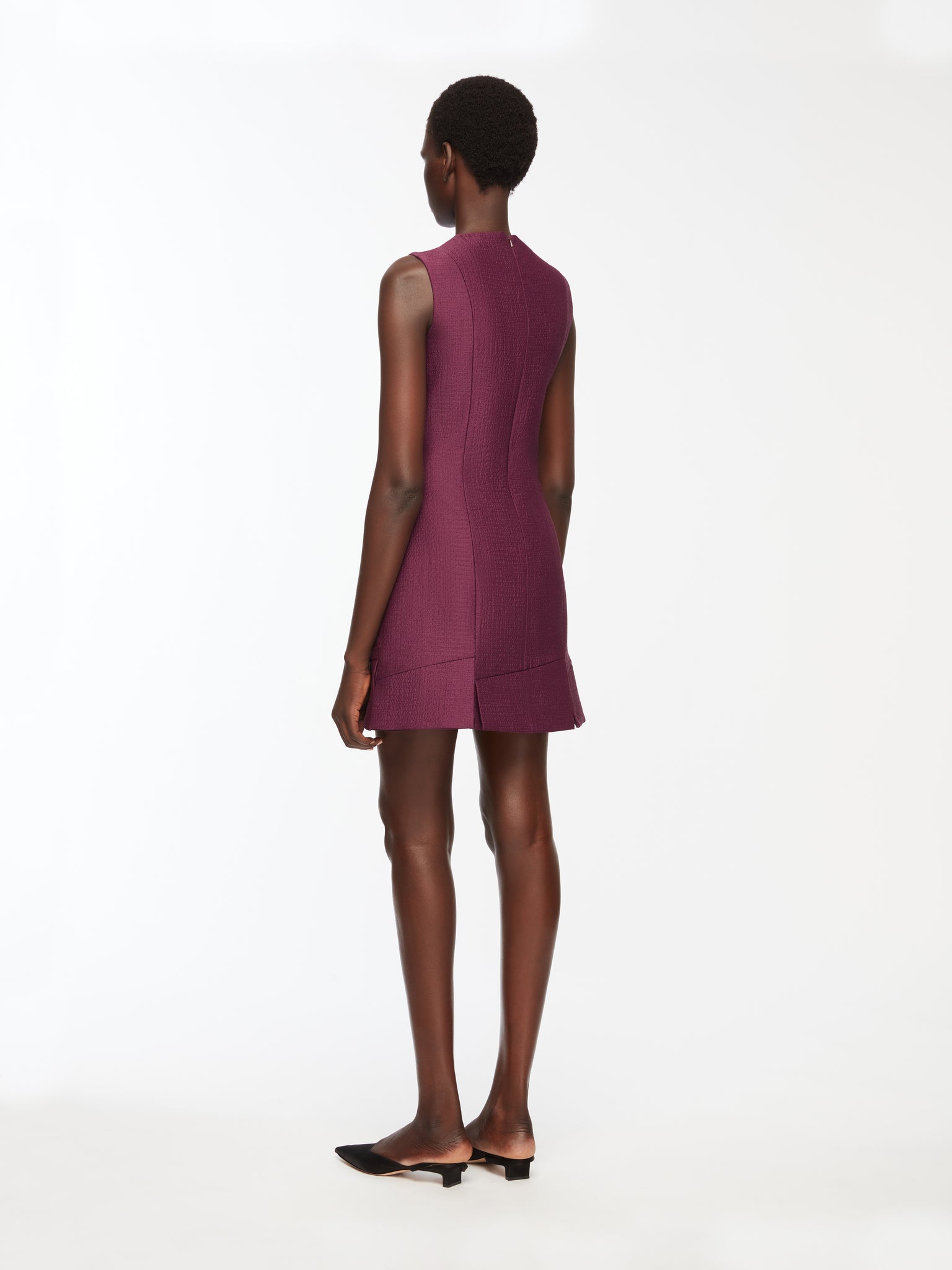 Petronella Dress In Plum Needle Punch Satin Model Back Shot | Emilia Wickstead